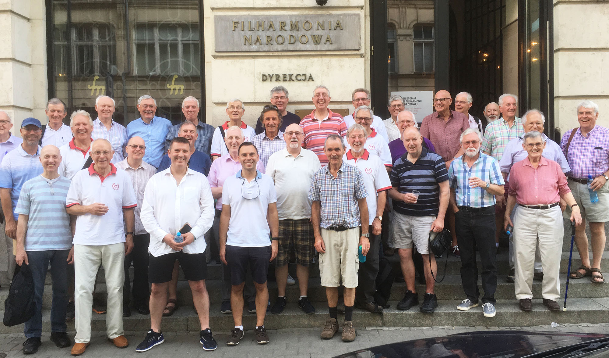 Reading Male Voice Choir relax outside the National Philharmonia, Warsaw, Poland