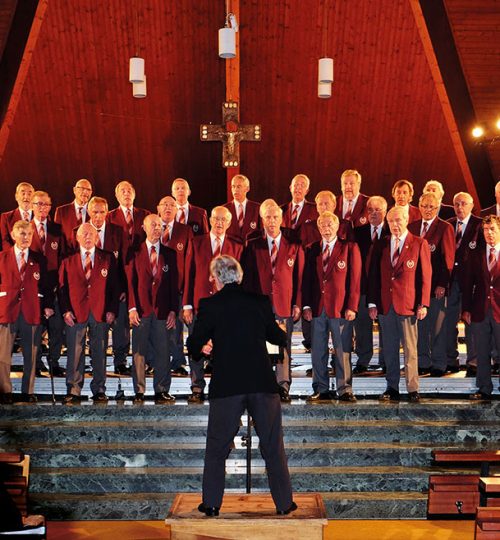 Men singing in achurch